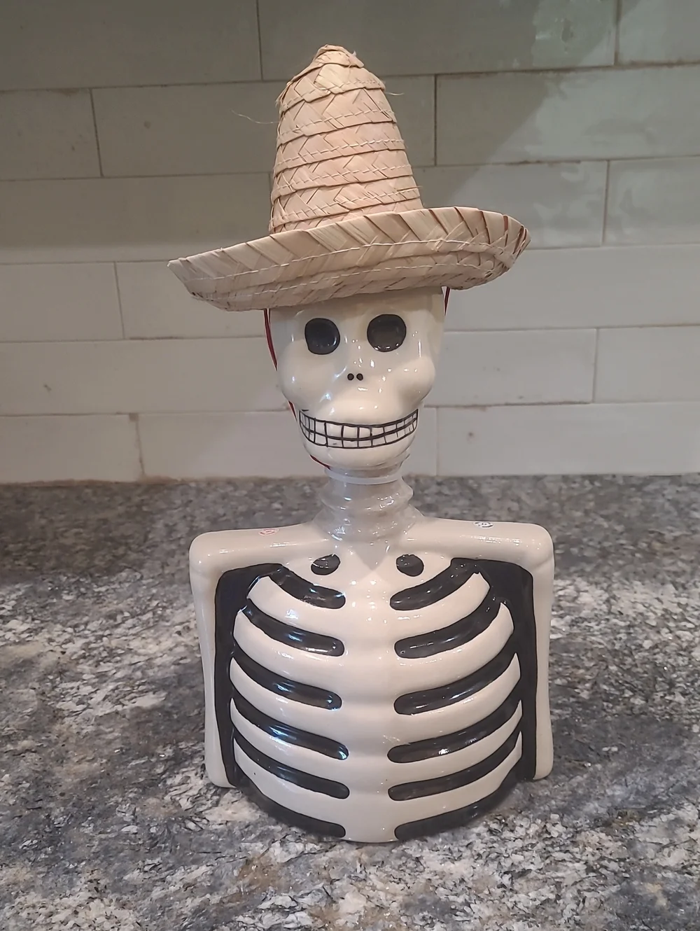 Ceramic Skeleton Bust Décor in White and Black with Straw Hat Accent
